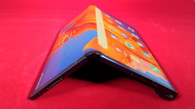 In this Feb. 18, 2020 photo, a view of the latest version of Chinese tech company Huawei’s folding smartphone, the Mate Xs, on display, at a press preview in London It’s the company’s first folding device to be available internationally and will compete in the niche category with new models from Samsung and Motorola. The company used a video livestream for the phone’s debut instead of a press launch originally planned at a mobile tech show in Spain that was cancelled over worries about the virus outbreak.