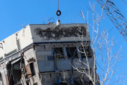 A wrecking ball smashes against the 'Leaning Tower of Dallas' north of downtown Dallas, Monday, Feb. 24, 2020. The still-standing structure is part of the 11-story former Affiliated Computer Services building that found a second life online after a Feb. 16 implosion attempt. The company that engineered the blast said some explosives did not go off.