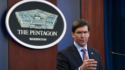 In this Dec. 20, 2019, file photo Defense Secretary Mark Esper speaks during a news conference at the Pentagon in Washington. The Pentagon is adopting new ethical principles as it prepares to accelerate its use of artificial intelligence technology on the battlefield.