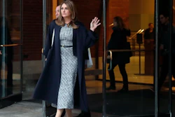 Michelle Janavs leaves federal court, Tuesday, Feb. 25, 2020, in Boston, after being sentenced to five months in prison for trying to cheat and bribe her daughters' way into college as part of a nationwide college cheating scam.