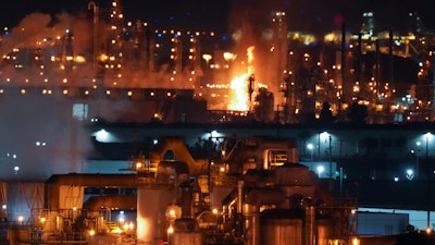A fire burns after an explosion at the Marathon Refinery in Carson on Tuesday, Feb. 25, 2020.