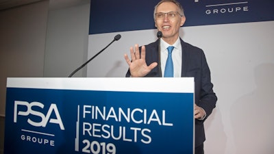 CEO of PSA Groupe Carlos Tavares arrives for the presentation of the company's 2019 full year results, in Rueil-Malmaison, west of Paris, Wednesday, Feb. 26, 2020. The French carmaker announced a new profitability record in 2019.