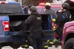 This image provided by WISN-TV, police respond to a possible shooting at the Molson Coors Brewing Co. campus in Milwaukee on Wednesday, Feb. 26, 2020. WISN-TV reported Wednesday that a Molson Coors employee received an email about an active shooter near one of the buildings.