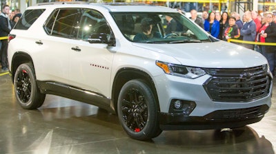 Darrell Kransz, a GM employee for 43.7 years, who also drove the 1 and 2 millionth vehicles produced, positions for a photo in a 2020 Chevrolet Traverse Premier Redline Edition after it rolled off the production line.