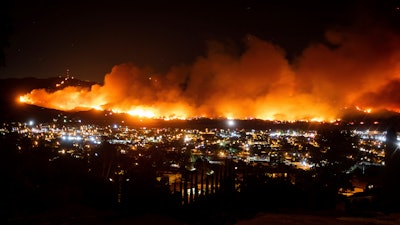 In this Oct. 31, 2019, file photo, smoke from the Maria Fire billows above Santa Paula, Calif.