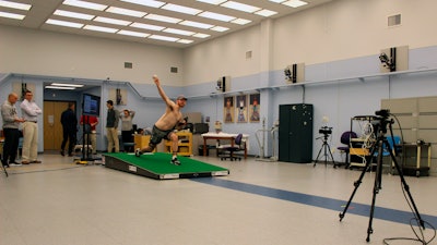 Central Connecticut pitcher Michael DeLease throws off a smart mound at the Center for Motion Analysis in Farmington, Connecticut.