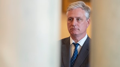 National security adviser Robert O'Brien, listens as President Donald Trump addresses the nation from the White House in Washington.