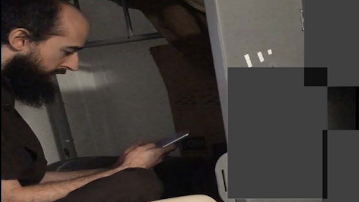Joshua Schulte is seen using a contraband cell phone while located within the premises of the Metropolitan Correctional Center in Manhattan on June, 17 2019.