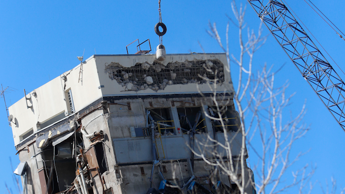 A wrecking ball smashes against the 'Leaning Tower of Dallas' north of downtown Dallas, Monday, Feb. 24, 2020. The still-standing structure is part of the 11-story former Affiliated Computer Services building that found a second life online after a Feb. 16 implosion attempt. The company that engineered the blast said some explosives did not go off.