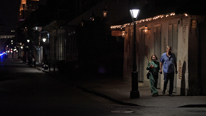 A couple walks past Lafitte's Blacksmith Shop, known as the oldest bar in the United States dating back to the 1700s, which is closed due to an order from Louisiana's Governor John Bel Edwards to shut bars and restaurants state-wide to limit the spread of the coronavirus pandemic on Bourbon Street in New Orleans, La., Monday, March 16, 2020.