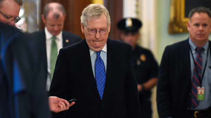 Senate Majority Leader Mitch McConnell of Ky., walks back to his office on Capitol Hill in Washington, Tuesday, March 17, 2020.