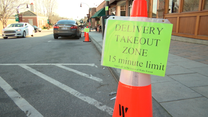 A sign stands outside White Street Brewing Company in Wake Forest, N.C., on Tuesday, March 17, 2020. With bars ordered close due to coronavirus, brewers are making sure their customers can enjoy some fresh suds.
