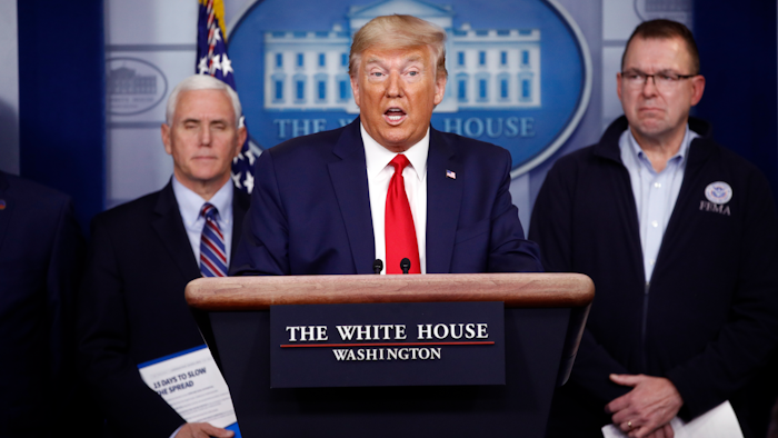 President Donald Trump speaks as Vice President Mike Pence, left, and FEMA Administrator Peter Gaynor look on during a coronavirus task force briefing at the White House, March 22, 2020.