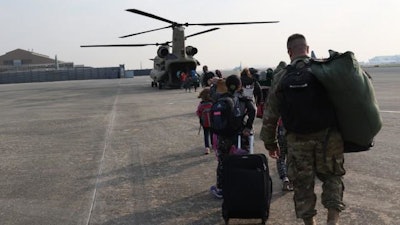 Family members representing installations and commands throughout US Forces Korea board a CH-47 Chinook Helicopter Daegu Air Base, Republic of Korea, Nov. 3, 2016, for noncombatant exercise Courageous Channel.