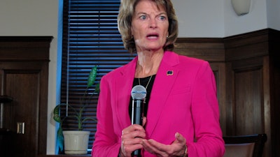 U.S. Sen. Lisa Murkowski speaks with reporters after a speech to the Alaska Legislature in Juneau, Feb. 18, 2020.