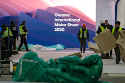 Workers dismantle a booth after that the 90th Geneva International Motor Show (GIMS) is cancelled by Swiss authorities, at the Palexpo in Geneva, Switzerland, Friday, Feb. 28, 2020. The 90th edition of the International Motor Show, scheduled to begin on March 5th, is cancelled due to the advancement of the (Covid-19) coronavirus in Switzerland. The Swiss confederation announced today that all events involving more than 1,000 people would be banned until 15 March.