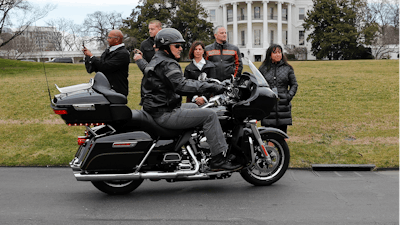 Harley Davidson President and CEO Matthew S. Levatich rides his motorcycle onto the South Lawn of the White House in Washington before a meeting with President Donald Trump and Vice President Mike Pence.