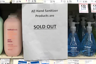 A sign on a shelf at a QFC grocery store in Kirkland, Wash., advises shoppers, Tuesday, March 3, 2020, that all hand sanitizer products are sold out.