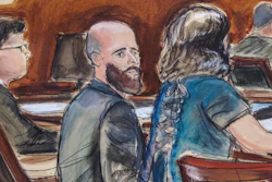 In this courtroom sketch Joshua Schulte, center, is seated at the defense table flanked by his attorneys during jury deliberations, Wednesday March 4, 2020, in New York. A federal jury in Manhattan has heard closing arguments in the espionage trial of Schulte, a former CIA software engineer charged in the largest leak of classified information in the agency's history.