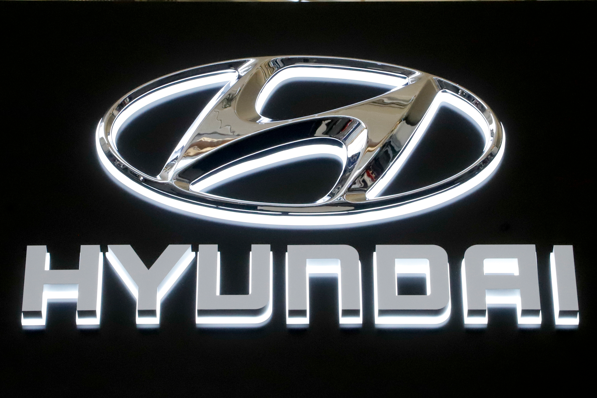 In this Feb. 14, 2019 file photo, this is the Hyundai logo on a sign at the 2019 Pittsburgh International Auto Show in Pittsburgh. Hyundai is joining affiliated automaker Kia in yet another U.S. recall for problems that could cause engine fires.Hyundai says Wednesday, March 4, 2020, that it's recalling nearly 207,000 Sonata midsize cars from 2013 and 2014 because a hose that connects one fuel pump to another can develop cracks, leak fuel and potentially cause a fire.