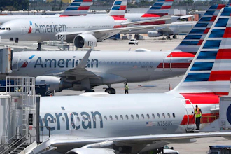 In this April 24, 2019, photo, American Airlines aircraft are shown parked at their gates at Miami International Airport in Miami. A veteran airline mechanic has been sentenced to three years in prison for sabotaging an American Airlines jetliner in Miami with 150 people aboard. The lawyer for 60-year-old Abdul-Majeed Marouf Ahmed Alani said at a hearing Wednesday, March 4, 2020, that the mechanic's sole motive in July was to earn overtime fixing the plane.