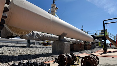 In this June 8, 2017, file photo, fresh nuts, bolts and fittings are ready to be added to the east leg of the pipeline near St. Ignace, Michigan.