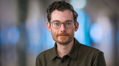 In this Feb. 7, 2019 photo provided by the Fred Hutch News Service, Trevor Bedford, a computational biologist at the Fred Hutchinson Cancer Research Center, poses at the center in Seattle. Bedford is among a group of scientists who are contributing data to the decision-making in Washington state with regards to containing the new coronavirus outbreak.