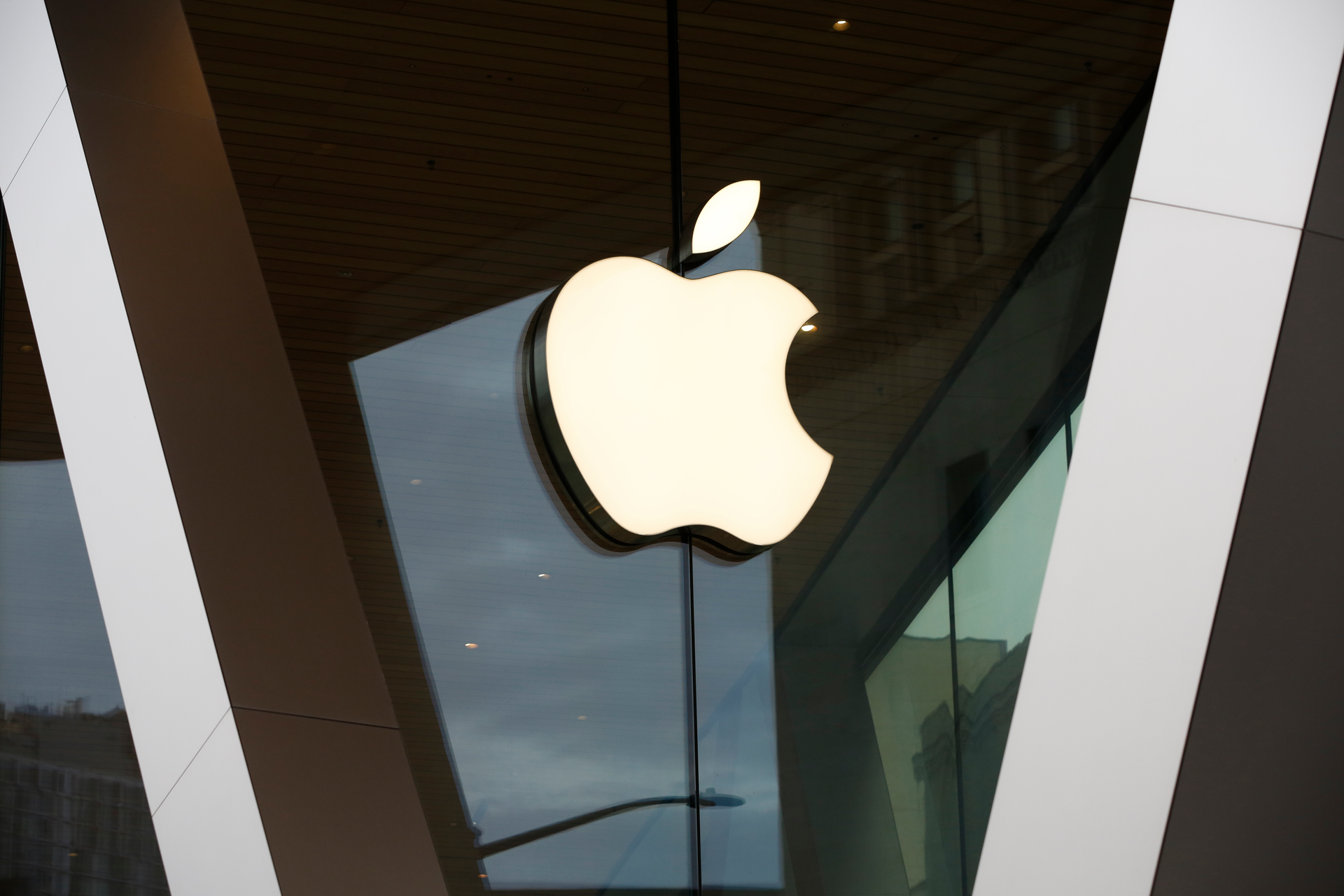 An Apple logo adorns the facade of the downtown Brooklyn Apple store in New York on Saturday, March 14, 2020. Apple has said it would close most of its retail stores outside mainland China, Hong Kong and Taiwan for two weeks.