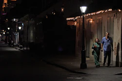 A couple walks past Lafitte's Blacksmith Shop, known as the oldest bar in the United States dating back to the 1700s, which is closed due to an order from Louisiana's Governor John Bel Edwards to shut bars and restaurants state-wide to limit the spread of the coronavirus pandemic on Bourbon Street in New Orleans, La., Monday, March 16, 2020.