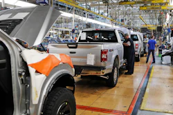 In this Sept. 27, 2018, file photo a United Auto Workers assemblymen work on a 2018 Ford F-150 trucks being assembled at the Ford Rouge assembly plant in Dearborn, Mich. The United Auto Workers union wants Detroit's three automakers to shut down their factories for two weeks to keep its members safe from the spreading coronavirus. But union President Rory Gamble says in an email to members obtained by The Associated Press that the companies were not willing to shut factories down.