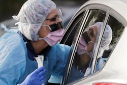 Laurie Kuypers, a registered nurse, at a drive-through COVID-19 testing station in Seattle, March 17, 2020.