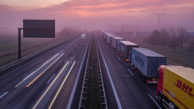 Trucks are jammed in the early morning on Autobahn 12 in front of the German-Polish border crossing near Frankfurt (Oder), Germany, Wednesday, March 18, 2020.