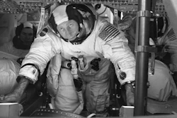 This March 26, 1971 photo made available by NASA shows astronauts Al Worden, center, Dave Scott, left, and Jim Irwin in the Command Module for an altitude chamber test at Cape Canaveral, Fla. Worden, who circled the moon alone in 1971 while his two crewmates tried out the first lunar rover, has died at age 88, his family said Wednesday, March 18, 2020.