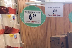 This March 10, 2020 photo made by an investigator with the Michigan Attorney General's Office shows gallons of Clorox bleach on display priced at $8.99 each at a Menards store in Jackson, Mich. A price sticker on an empty shelf elsewhere in the store listed a gallon of Clorox bleach as $4.47. A Menards spokesman told AP the price was different because Clorox recently began offering new, upgraded concentrations of bleach. The company was “disappointed” and taking the AG’s office cease-and-desist letter “very seriously.”