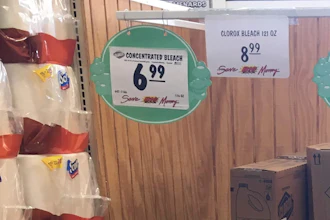 This March 10, 2020 photo made by an investigator with the Michigan Attorney General's Office shows gallons of Clorox bleach on display priced at $8.99 each at a Menards store in Jackson, Mich. A price sticker on an empty shelf elsewhere in the store listed a gallon of Clorox bleach as $4.47. A Menards spokesman told AP the price was different because Clorox recently began offering new, upgraded concentrations of bleach. The company was “disappointed” and taking the AG’s office cease-and-desist letter “very seriously.”