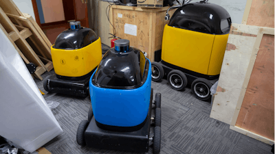 In this March 18, 2020, photo, robots are parked in a room at the offices of ZhenRobotics in Beijing. While other industries struggle, one robot maker says China's virus outbreak is boosting demand for his knee-high, bright yellow robots to deliver groceries and patrol malls for shoppers who fail to wear masks.