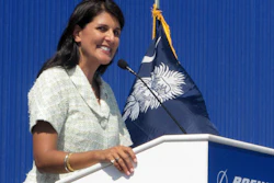 In this June 10, 2011 file photo former South Carolina Gov. Nikki Haley speaks during the dedication of Boeing Co.'s $750 million final assembly plant in North Charleston, S.C.