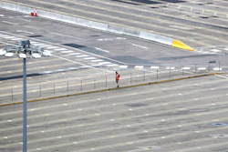 A man walks through empty passenger lanes at the Port of Dover, south east England, Friday March 20, 2020.
