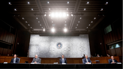 From left, Labor Secretary Eugene Scalia, Senate Majority Leader Mitch McConnell of Ky., Treasury Secretary Steven Mnuchin, Senate Minority Leader Sen. Chuck Schumer of N.Y., and White House chief economic adviser Larry Kudlow attend a a meeting to discuss the coronavirus relief bill on Capitol Hill, Friday, March 20, 2020, in Washington.