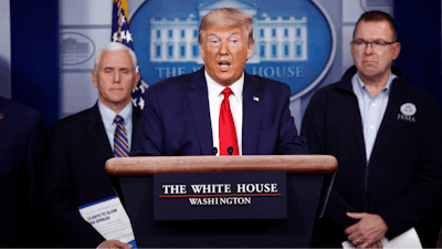 President Donald Trump speaks as Vice President Mike Pence, left, and FEMA Administrator Peter Gaynor look on during a coronavirus task force briefing at the White House, March 22, 2020.