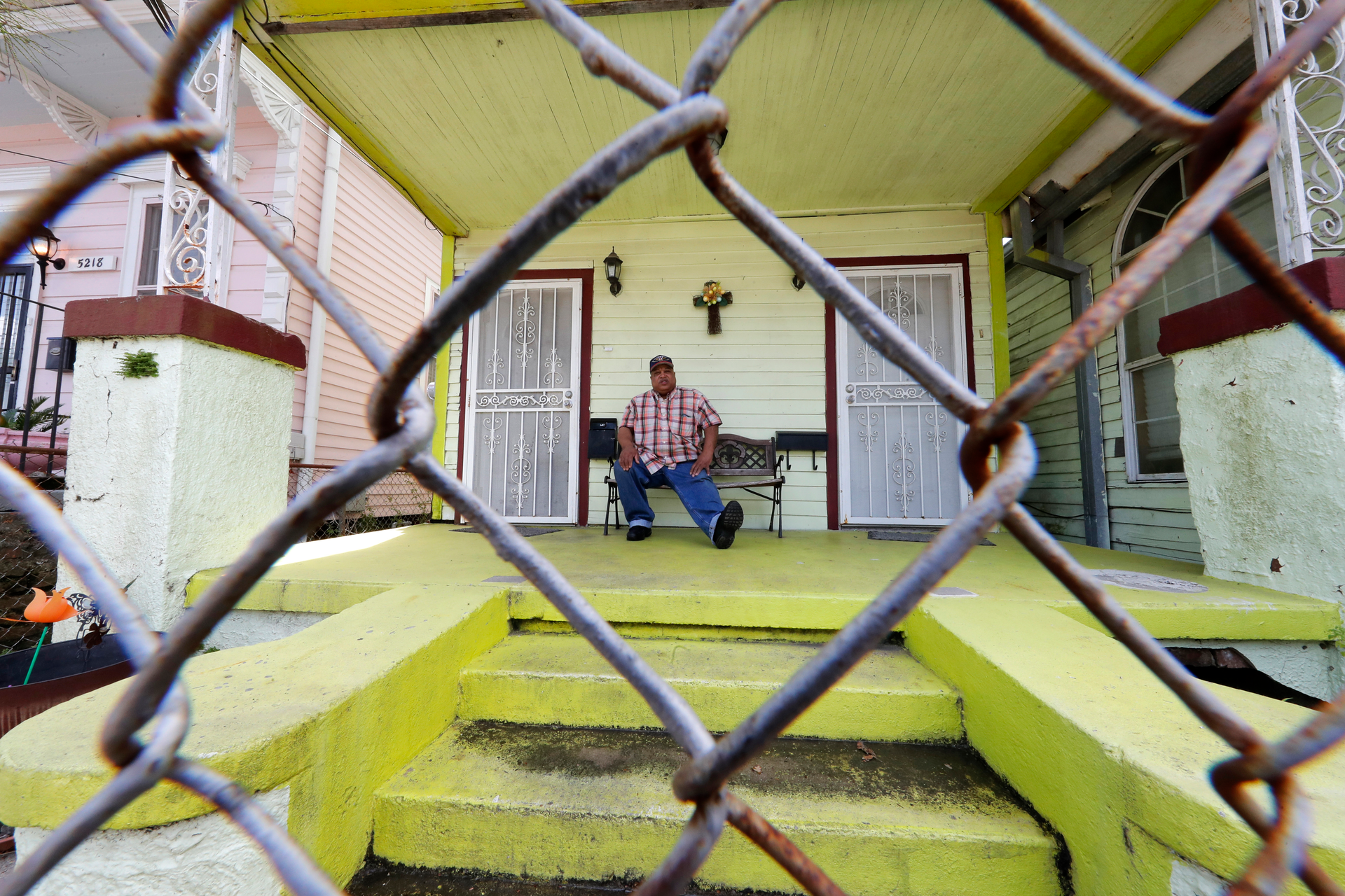 In this March 24, 2020, photo, David McGraw poses for a portrait as he sits on his front porch in New Orleans. Barely a week ago, McGraw was cooking daily for hundreds of fine diners at one of New Orleans&rsquo; illustrious restaurants. Today, he&rsquo;s cooking for himself, at home, laid off along with hundreds of thousands of people across the U.S. in a massive economic upheaval spurred by efforts to slow the spread of the coronavirus.
