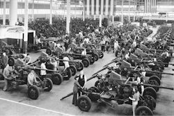 In this April 3, 1944, file photo Bofors guns used by the Army and Navy are shown lined up at the Firestone Tire & Rubber Co. in Akron, Ohio. Not since World War II when factories converted from making automobiles to making tanks, Jeeps and torpedos has the entire nation been asked to truly sacrifice for a greater good.