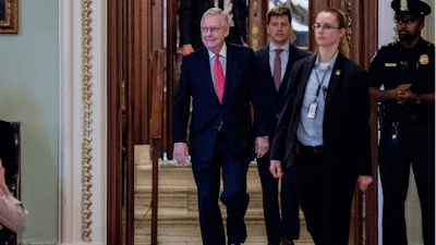 Senate Majority Leader Mitch McConnell of Ky. leaves the Senate chamber on Capitol Hill, Wednesday, March 25, 2020, in Washington.