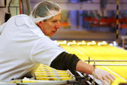 In this April 2, 2003 file photo, a worker at the Just Born factory in Bethlehem, Pa., keeps an eye on the Marshmallow Peeps that pass by on the conveyor belt.