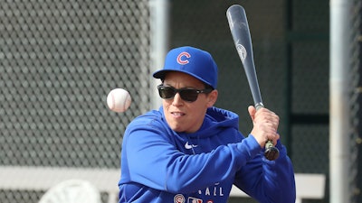 Chicago Cubs minor league hitting coach Rachel Folden hits infield ground balls at the Cubs spring trainng facility in Mesa, Ariz., Feb. 5, 2020. Folden figured something out early on during her first spring training with the Chicago Cubs — long before the coronavirus pandemic wiped out team activities. None of the players care all that much that one of their coaches is a woman.