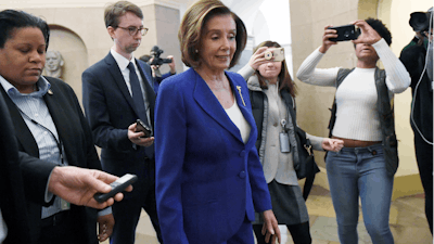House Speaker Nancy Pelosi of Calif., arrives on Capitol Hill in Washington, Friday, March 27, 2020.