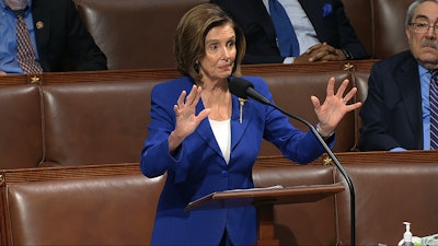 In this image from video, House Speaker Nancy Pelosi of Calif., speaks on the floor of the House of Representatives at the U.S. Capitol in Washington, Friday, March 27, 2020.