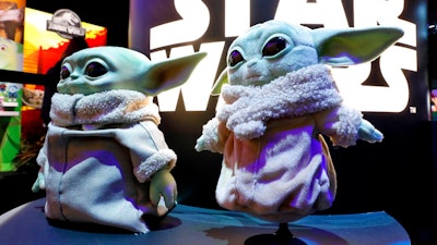 A pair of Baby Yoda dolls, by Mattel, are displayed at Toy Fair New York, in the Javits Convention Center, Monday, Feb. 24, 2020.