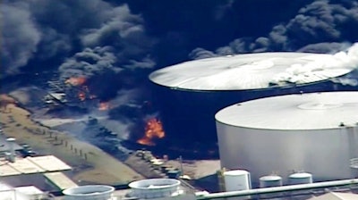 This aerial image from video provided by KSTP-TV in Minneapolis, shows smoke rising from the Husky Energy oil refinery after an explosion Thursday, April 26, 2018, at the plant in Superior, Wis.