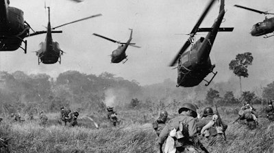 U.S. Army helicopters cover the advance of ground troops near the Cambodian border, March 1965.